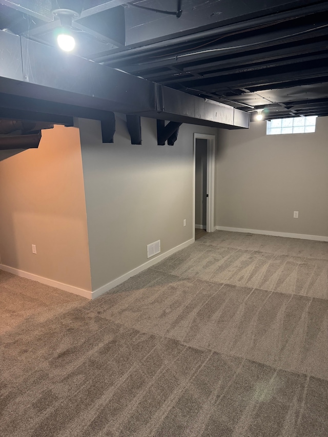 basement with carpet flooring