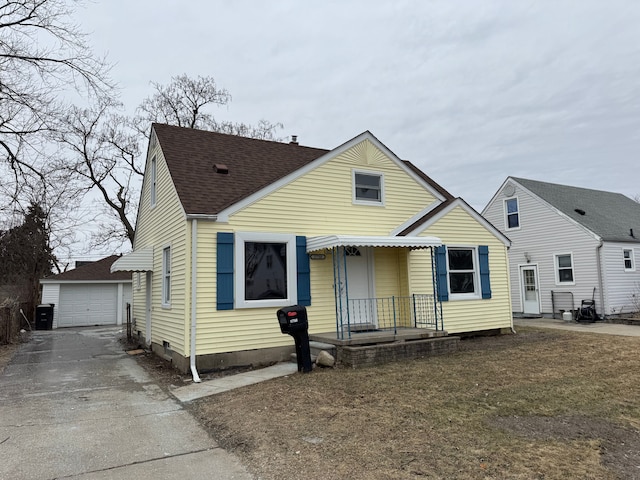 view of front of property with an outbuilding and a garage