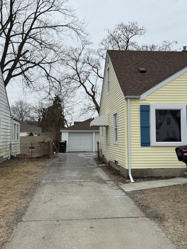 view of side of property featuring an outbuilding and a garage