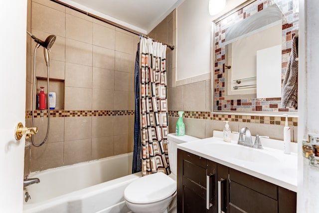 full bathroom featuring tile walls, vanity, toilet, and shower / tub combo