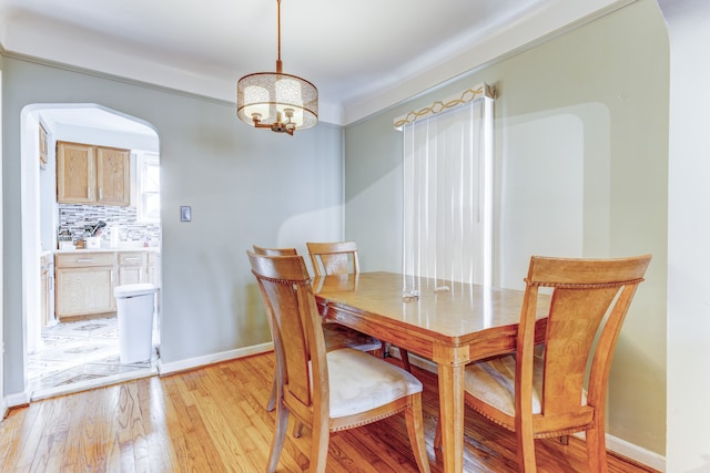 dining area with light hardwood / wood-style floors