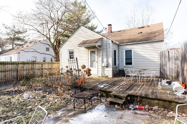 back of house with a wooden deck