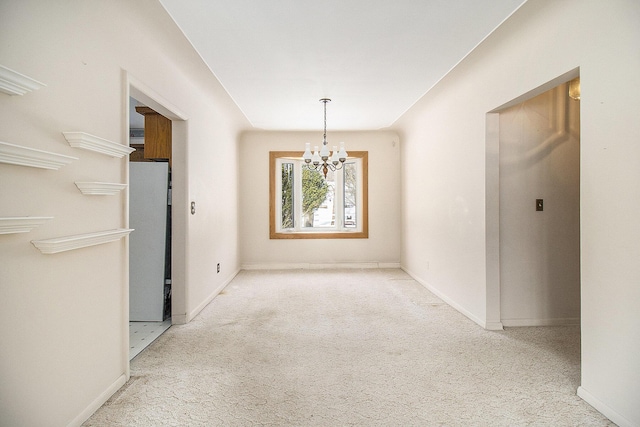 unfurnished dining area featuring carpet floors and a chandelier