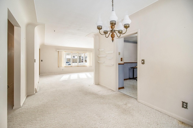 interior space featuring carpet floors and a notable chandelier