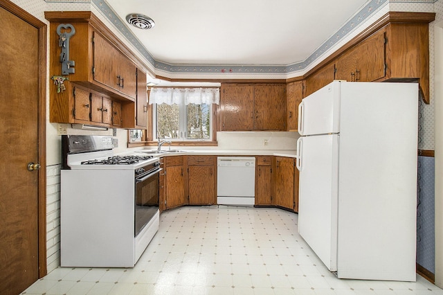 kitchen with white appliances and sink