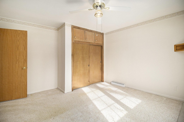 unfurnished bedroom with light carpet, ceiling fan, and a closet