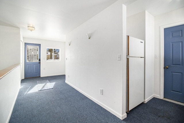 view of carpeted foyer