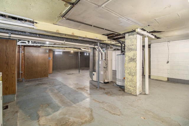 basement with heating unit and water heater