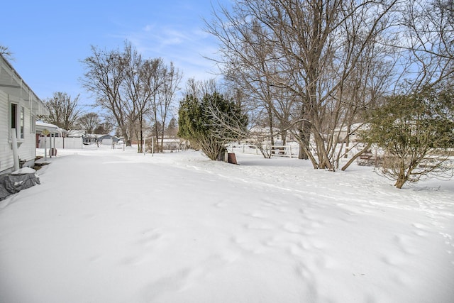 view of yard layered in snow