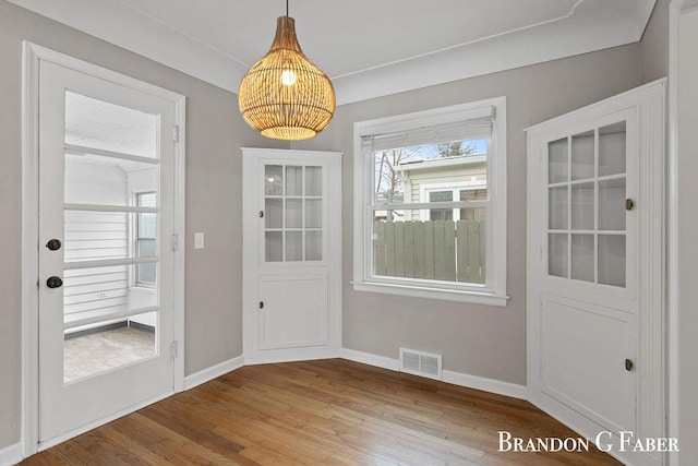 doorway to outside with hardwood / wood-style flooring