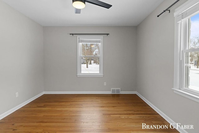 empty room featuring ceiling fan and light hardwood / wood-style floors