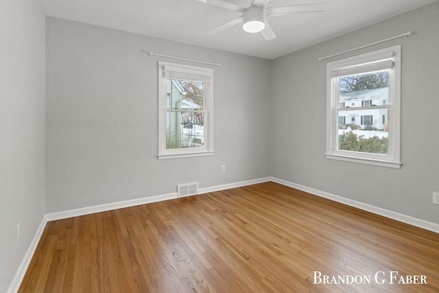 spare room with ceiling fan and light hardwood / wood-style flooring