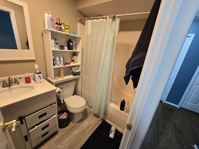 full bathroom with shower / bath combination with curtain, wood-type flooring, toilet, and vanity