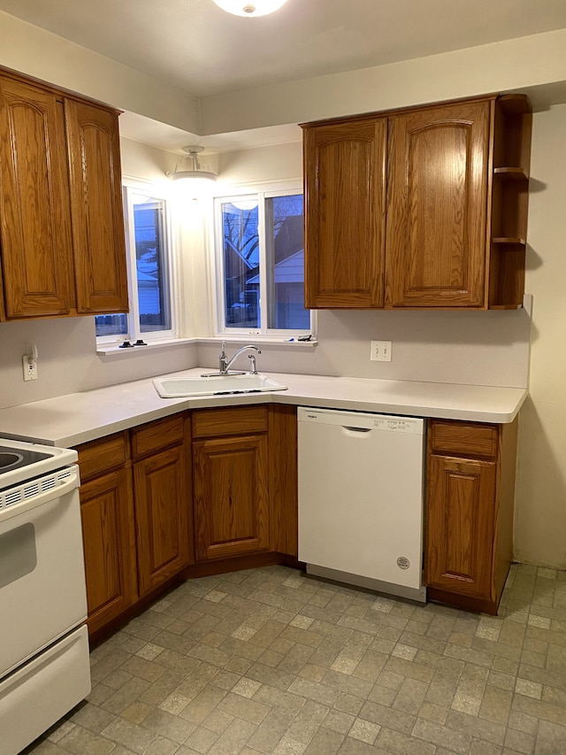 kitchen with sink and white appliances