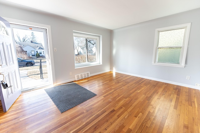 spare room featuring wood-type flooring