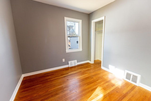 unfurnished room with light hardwood / wood-style floors