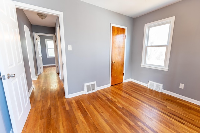 unfurnished bedroom with light wood-type flooring