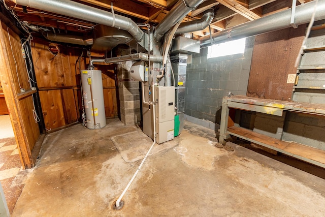 basement with water heater and heating unit