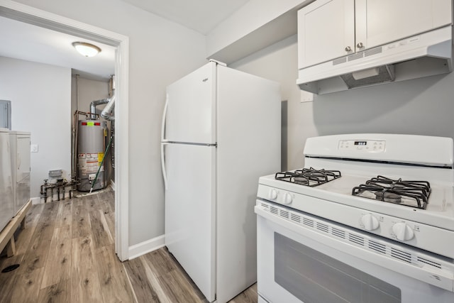 kitchen featuring white appliances, water heater, white cabinets, and light wood-type flooring