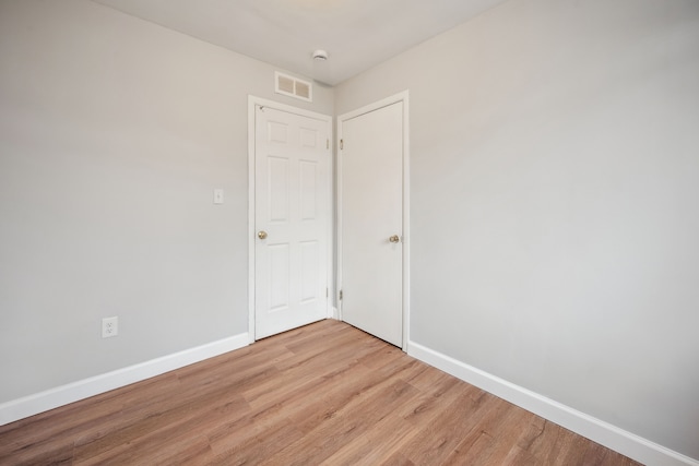 empty room with light wood-type flooring