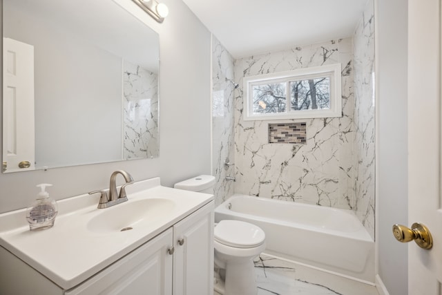 full bathroom with tiled shower / bath, vanity, and toilet