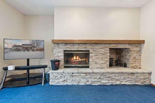 interior details with a fireplace and carpet flooring