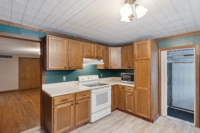 kitchen featuring light hardwood / wood-style flooring and electric stove