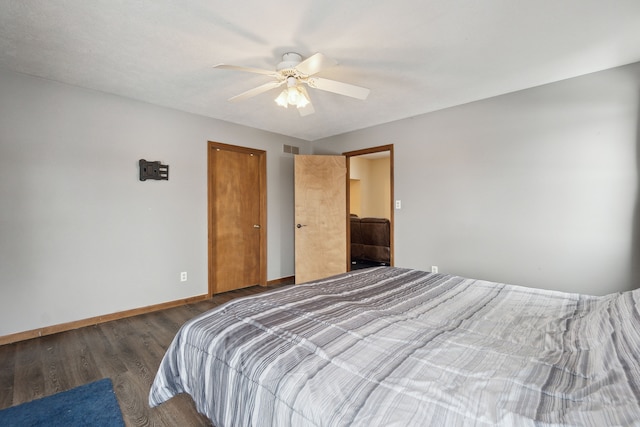 bedroom with ceiling fan and dark hardwood / wood-style flooring