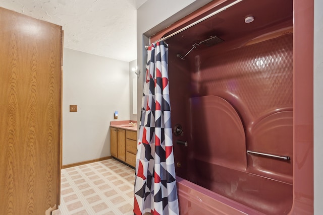 bathroom with vanity, a shower with curtain, and a textured ceiling