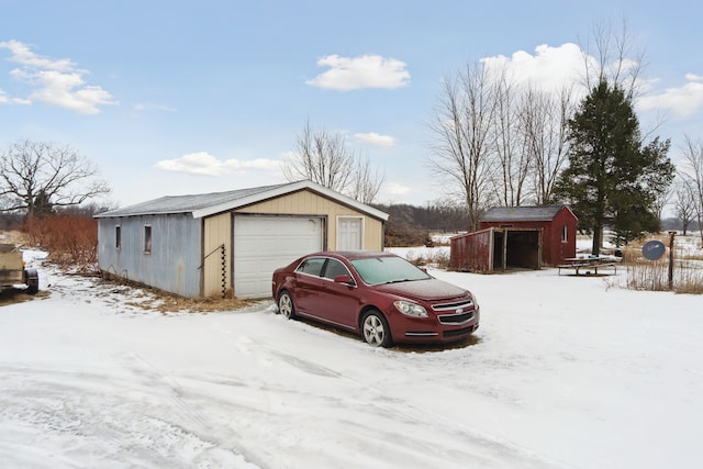 view of snow covered garage