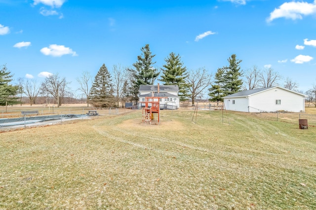 view of yard with a rural view and a playground