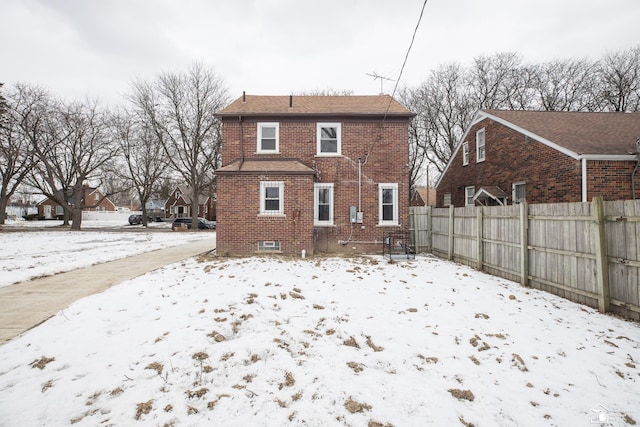 view of snow covered house