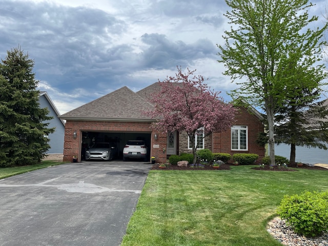 view of front of house with a front lawn and a garage