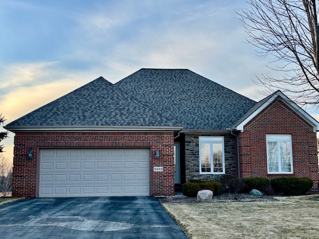 ranch-style home with brick siding, driveway, and a garage