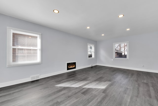 spare room featuring dark wood-type flooring