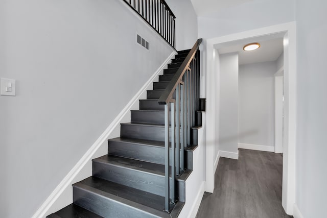 stairs with wood-type flooring