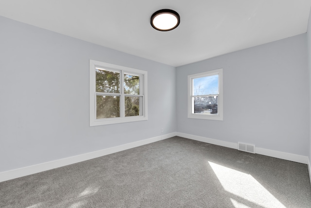 empty room featuring carpet flooring