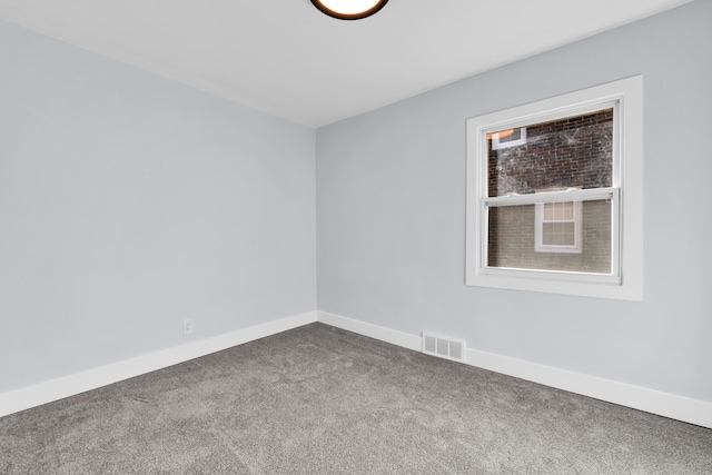 unfurnished room featuring carpet flooring