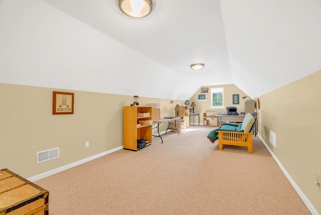 rec room with vaulted ceiling and light colored carpet