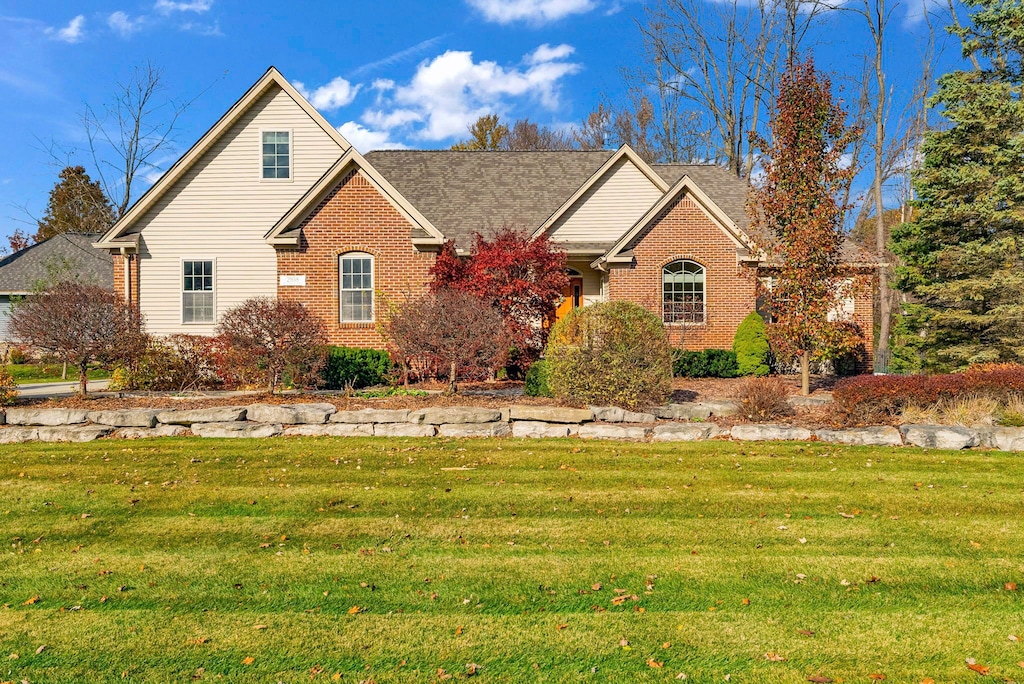 front facade with a front yard