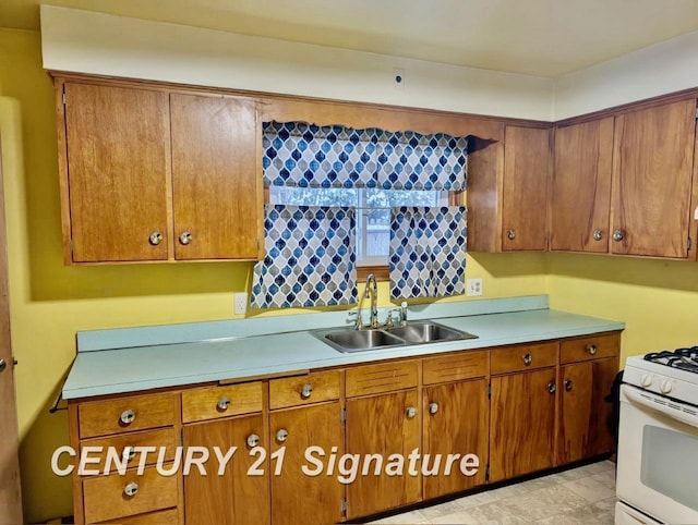 kitchen with sink and white gas stove