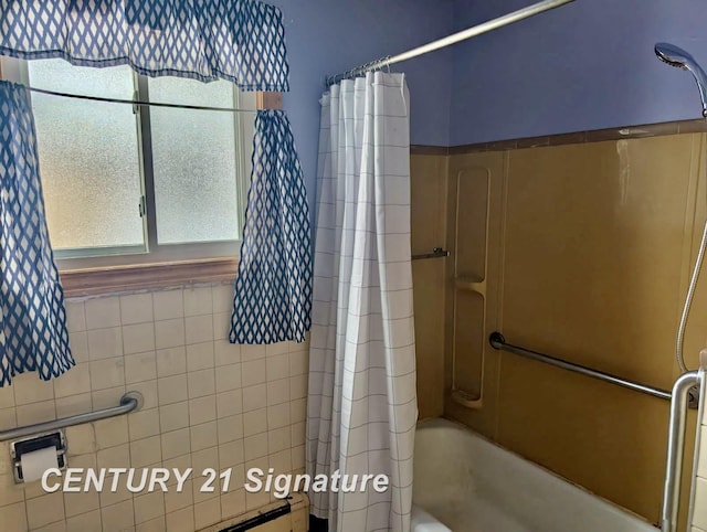 bathroom with shower / bathtub combination with curtain