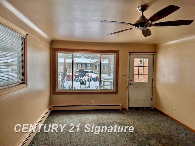 doorway to outside with baseboard heating and carpet