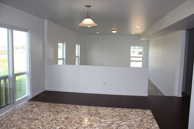 empty room featuring dark wood-type flooring