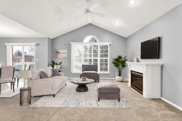 carpeted living room featuring lofted ceiling, a wealth of natural light, and ceiling fan