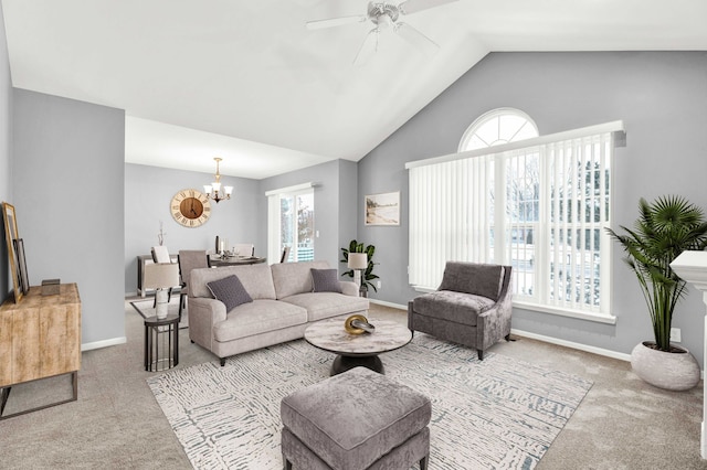 living room with light colored carpet, lofted ceiling, and ceiling fan with notable chandelier