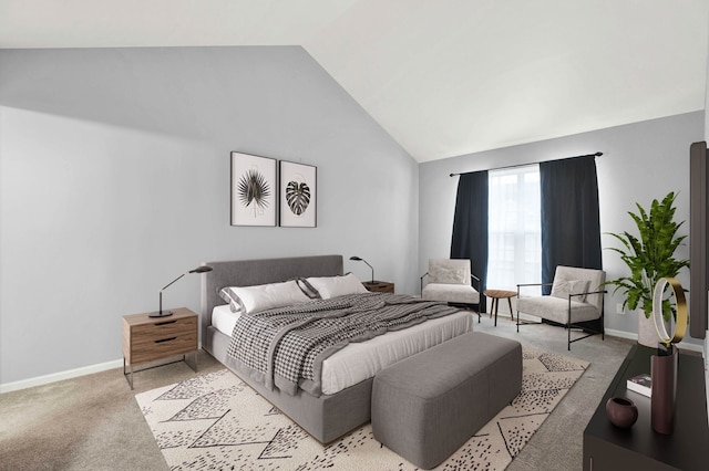 bedroom featuring lofted ceiling and light colored carpet