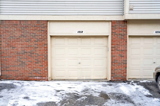 view of snow covered garage