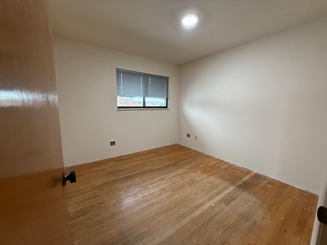 empty room with light hardwood / wood-style floors