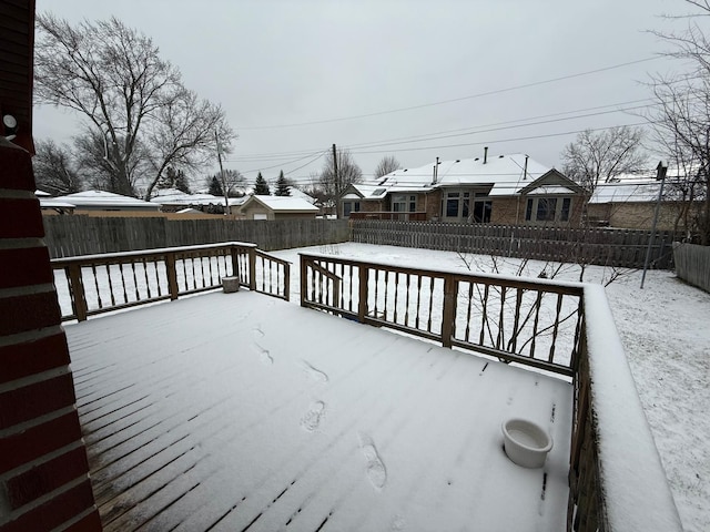 view of snow covered deck